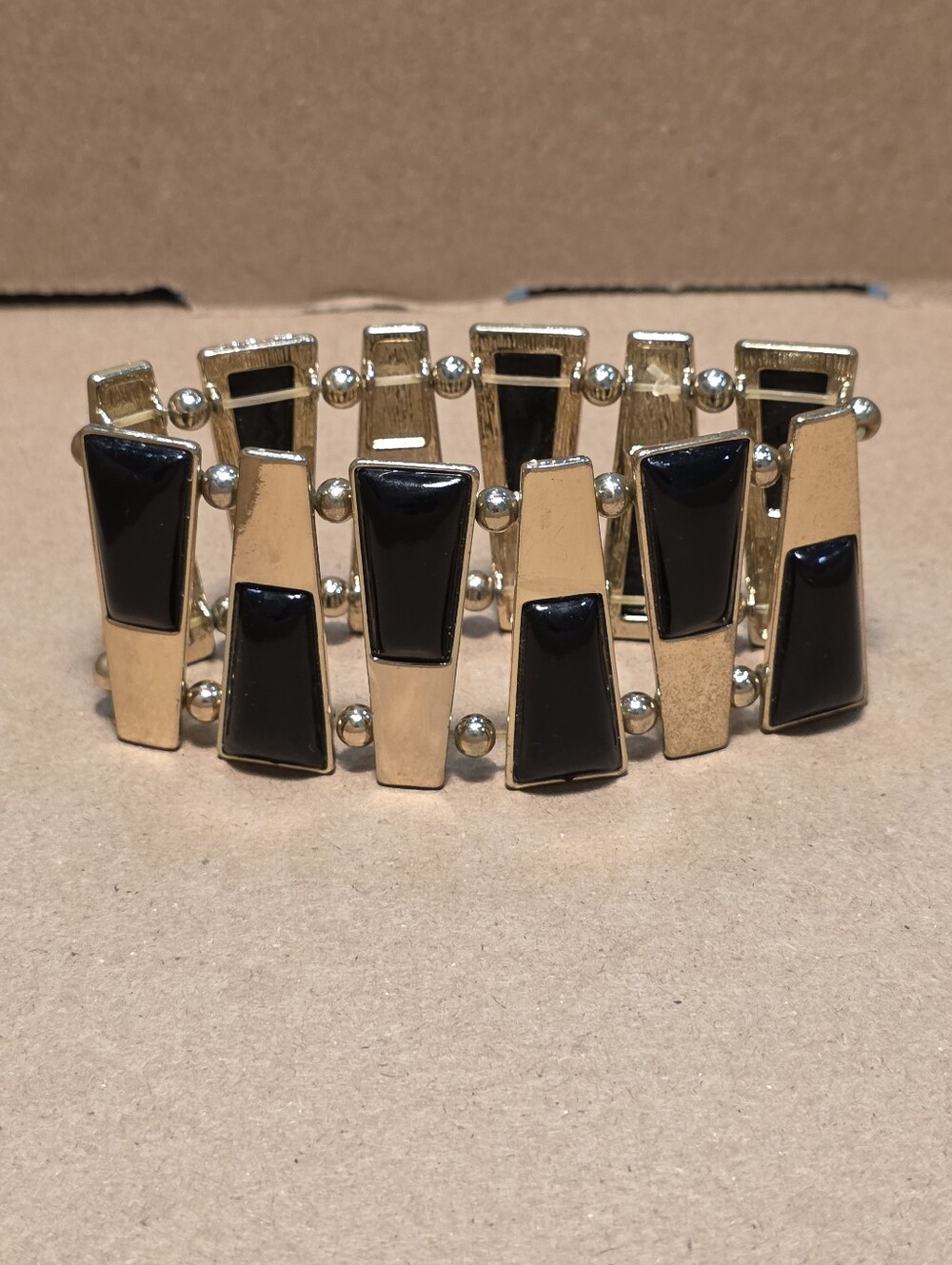 Elegant Black and Gold Metal Bracelet